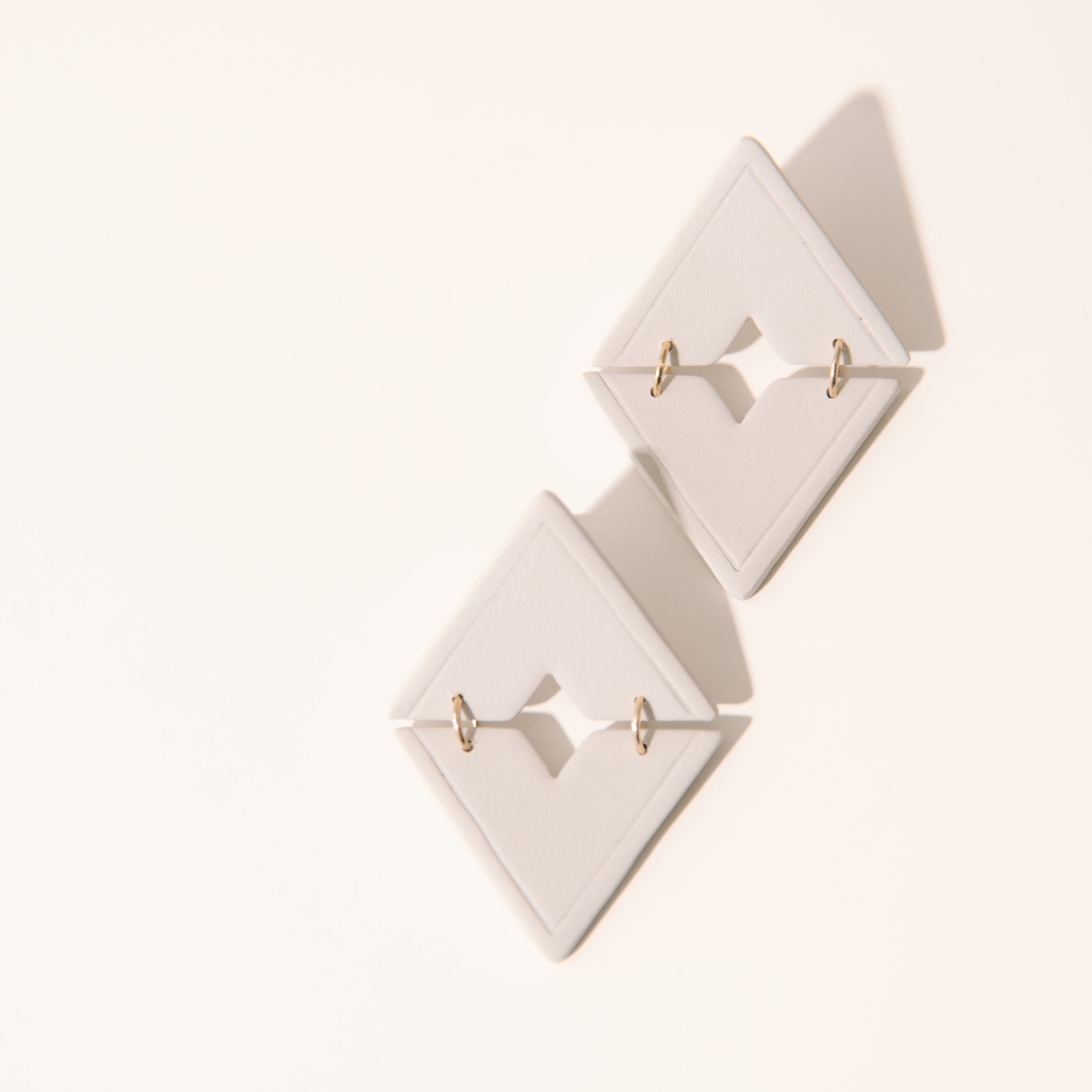 Cream Triangle Dangle Studs