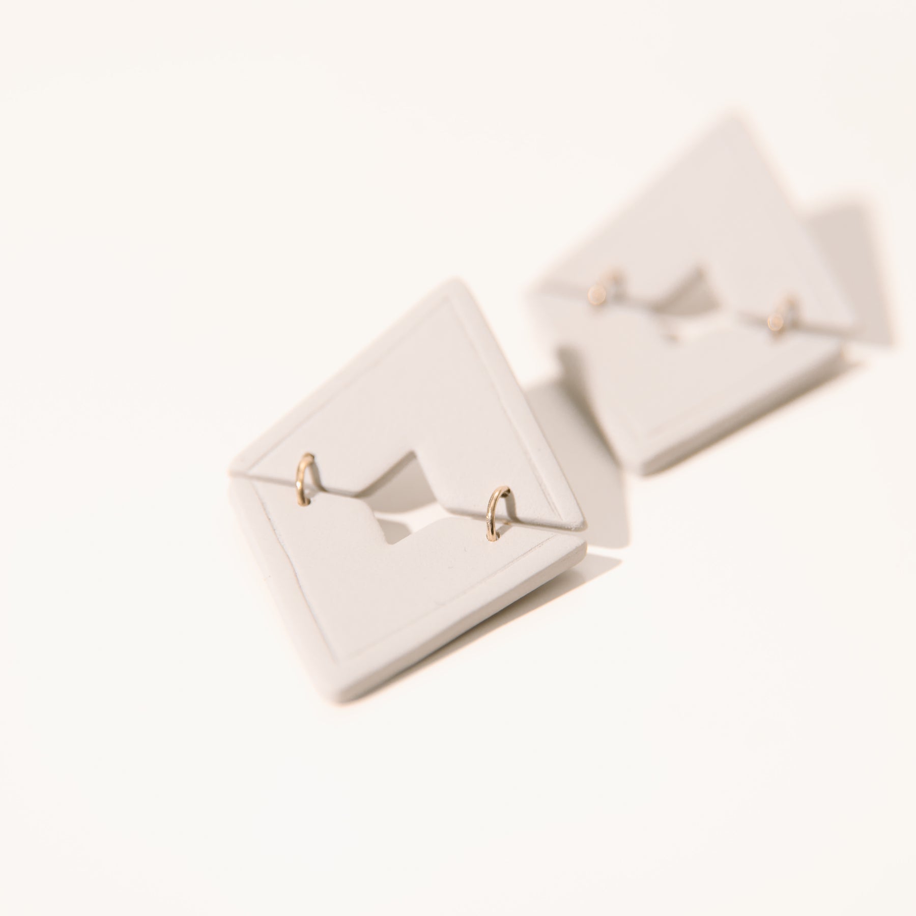 Cream Triangle Dangle Studs